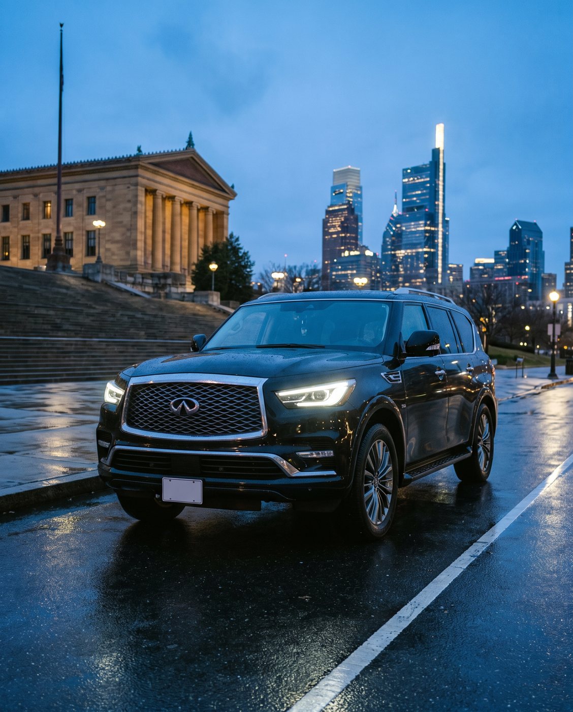 Black SUV on a wet city street at blue hour