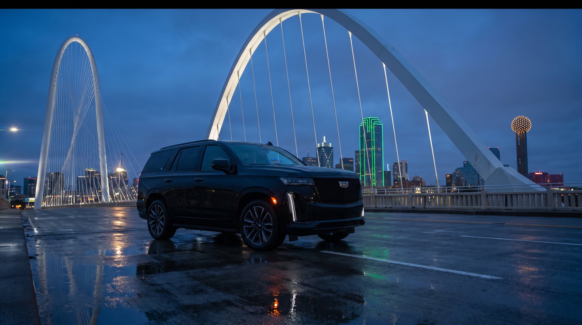 SUV on a wet plaza under an arched bridge